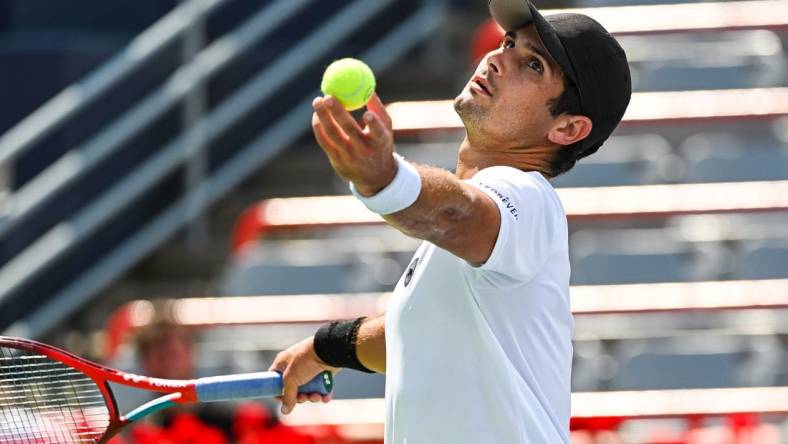 Aug 7, 2022; Montreal, Quebec, Canada; Marcos Giron (USA) serves the ball against Alexei Popyrin (AUS) (not pictured) in second round qualifying play at IGA Stadium. Mandatory Credit: David Kirouac-USA TODAY Sports