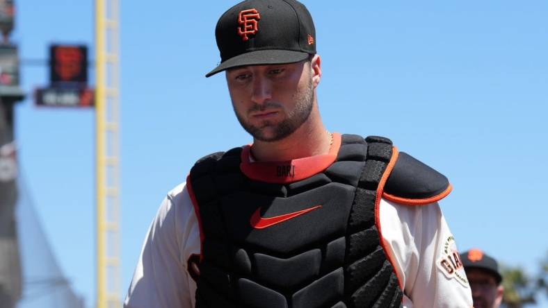 Aug 14, 2022; San Francisco, California, USA; San Francisco Giants catcher Joey Bart (21) walks to the dugout before the game against the Pittsburgh Pirates at Oracle Park. Mandatory Credit: Darren Yamashita-USA TODAY Sports