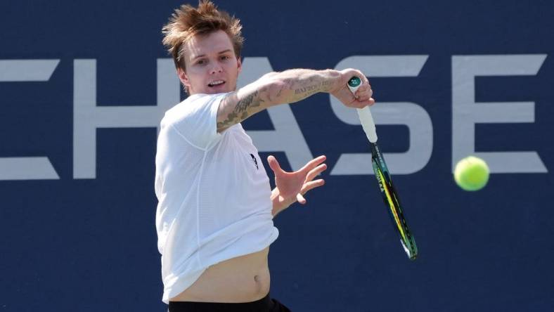 Aug 31, 2022; Flushing, NY, USA;  Alexander Bublik of Kazakhstan hits a shot against Pablo Carreno Busta of Spain on day three of the 2022 U.S. Open tennis tournament at USTA Billie Jean King Tennis Center. Mandatory Credit: Jerry Lai-USA TODAY Sports