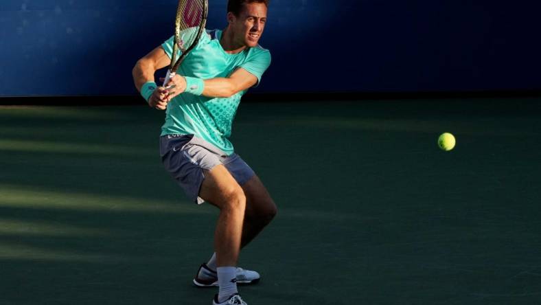 Sep 1, 2022; Flushing, NY, USA;  Roberto Carballes Baena of Spain hits a shot against Denis Shapovalov of Canada on day four of the 2022 U.S. Open tennis tournament at USTA Billie Jean King Tennis Center. Mandatory Credit: Jerry Lai-USA TODAY Sports