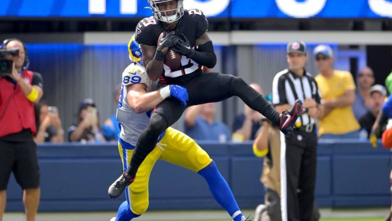 Sep 18, 2022; Inglewood, California, USA;  Atlanta Falcons cornerback Casey Hayward (29) intercepts a pass in the end zone intended for Los Angeles Rams tight end Tyler Higbee (89) in the second quarter at SoFi Stadium. Mandatory Credit: Jayne Kamin-Oncea-USA TODAY Sports