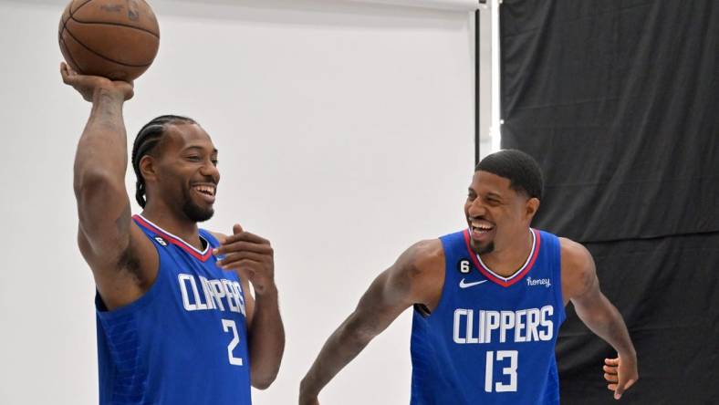 Sep 26, 2022; Playa Vista, CA, USA;  Los Angeles Clippers forward Kawhi Leonard (2) and Los Angeles Clippers guard Paul George (13) are photographed on media day at The Honey Training Center in Playa Vista, CA. Mandatory Credit: Jayne Kamin-Oncea-USA TODAY Sports