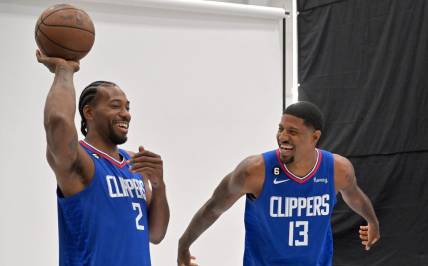 Sep 26, 2022; Playa Vista, CA, USA;  Los Angeles Clippers forward Kawhi Leonard (2) and Los Angeles Clippers guard Paul George (13) are photographed on media day at The Honey Training Center in Playa Vista, CA. Mandatory Credit: Jayne Kamin-Oncea-USA TODAY Sports