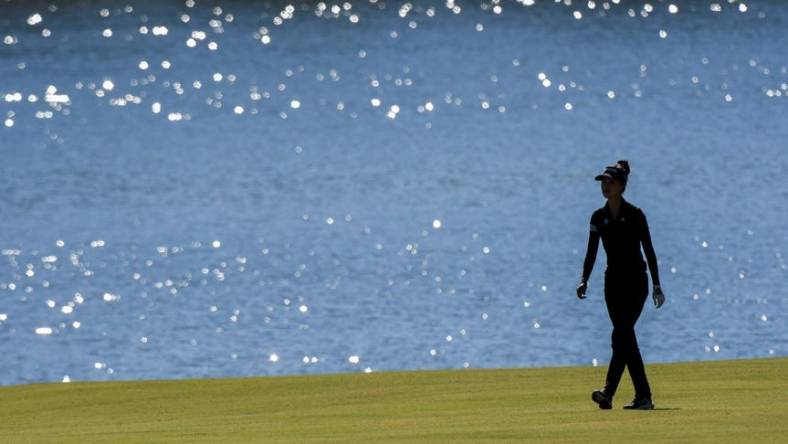 Sep 30, 2022; Tuscaloosa, AL, USA; Grace Kim walks beside the lake along the 18th fairway as she plays Friday, Sept. 30, 2022 at Ol' Colony Golf Complex during the first round of the Epson Tour event.

Golf Tuscaloosa Toyota Classic Epson Tour Event