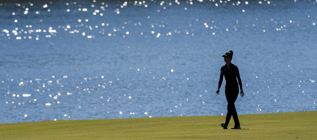 Sep 30, 2022; Tuscaloosa, AL, USA; Grace Kim walks beside the lake along the 18th fairway as she plays Friday, Sept. 30, 2022 at Ol' Colony Golf Complex during the first round of the Epson Tour event.

Golf Tuscaloosa Toyota Classic Epson Tour Event