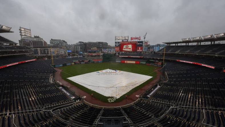 Oct 2, 2022; Washington, District of Columbia, USA; A general view of the tarp on the field during a rain delay in the game between the Washington Nationals and the Philadelphia Phillies at Nationals Park. Mandatory Credit: Scott Taetsch-USA TODAY Sports