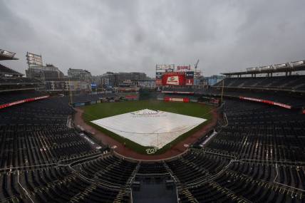 Oct 2, 2022; Washington, District of Columbia, USA; A general view of the tarp on the field during a rain delay in the game between the Washington Nationals and the Philadelphia Phillies at Nationals Park. Mandatory Credit: Scott Taetsch-USA TODAY Sports
