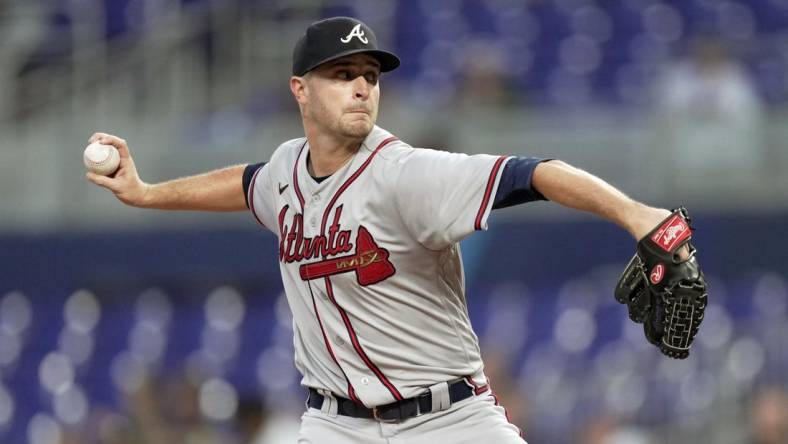 Oct 4, 2022; Miami, Florida, USA; Atlanta Braves starting pitcher Jake Odorizzi (12) delivers in the first inning against the Miami Marlins at loanDepot Park. Mandatory Credit: Jim Rassol-USA TODAY Sports