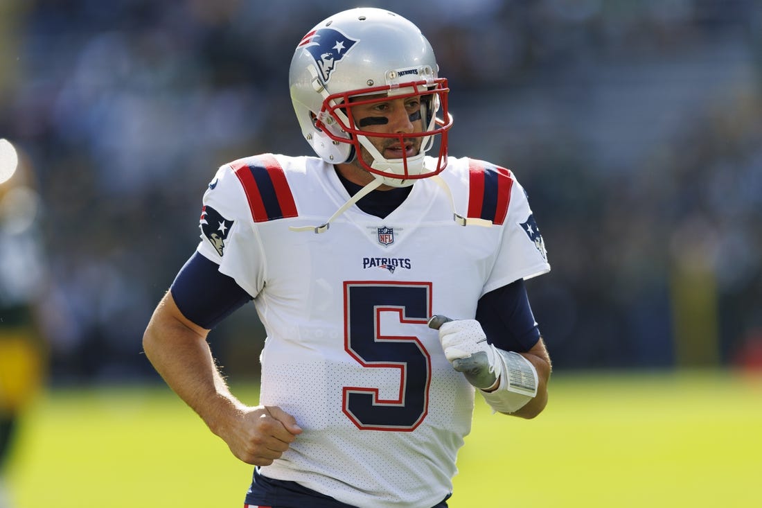 Oct 2, 2022; Green Bay, Wisconsin, USA;  New England Patriots quarterback Brian Hoyer (5) during warmups prior to the game against the Green Bay Packers at Lambeau Field. Mandatory Credit: Jeff Hanisch-USA TODAY Sports