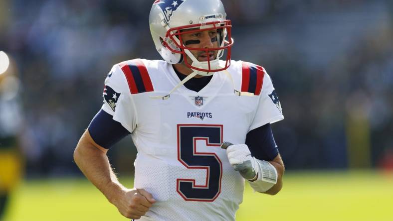 Oct 2, 2022; Green Bay, Wisconsin, USA;  New England Patriots quarterback Brian Hoyer (5) during warmups prior to the game against the Green Bay Packers at Lambeau Field. Mandatory Credit: Jeff Hanisch-USA TODAY Sports