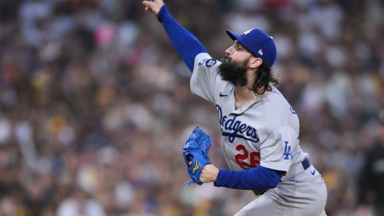 Oct 14, 2022; San Diego, California, USA; Los Angeles Dodgers starting pitcher Tony Gonsolin (26) throws a pitch in the first inning against the San Diego Padres during game three of the NLDS for the 2022 MLB Playoffs at Petco Park. Mandatory Credit: Orlando Ramirez-USA TODAY Sports