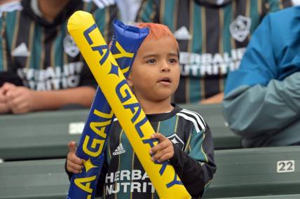 Oct 15, 2022; Carson, California, US; A young Los Angeles Galaxy fans looks on during the game against Nashville SC at Dignity Health Sports Park. Mandatory Credit: Jayne Kamin-Oncea-USA TODAY Sports