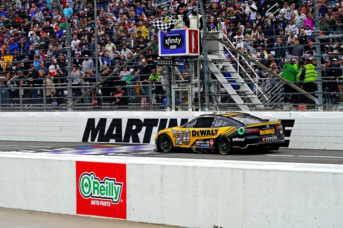 Oct 30, 2022; Martinsville, Virginia, USA; NASCAR Cup Series driver Christopher Bell (20) wins the Xfinity 500 at Martinsville Speedway. Mandatory Credit: Peter Casey-USA TODAY Sports