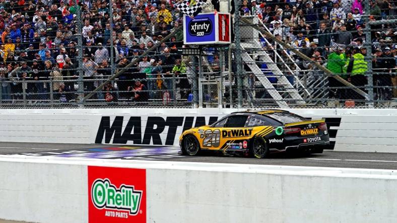 Oct 30, 2022; Martinsville, Virginia, USA; NASCAR Cup Series driver Christopher Bell (20) wins the Xfinity 500 at Martinsville Speedway. Mandatory Credit: Peter Casey-USA TODAY Sports