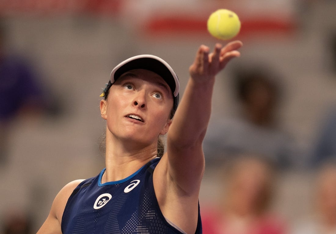 Nov 1, 2022; Forth Worth, TX, USA; Iga Swiatek (POL) tosses the ball to serve during her match against Daria Kasatkina on day two of the WTA Finals at Dickies Arena. Mandatory Credit: Susan Mullane-USA TODAY Sports