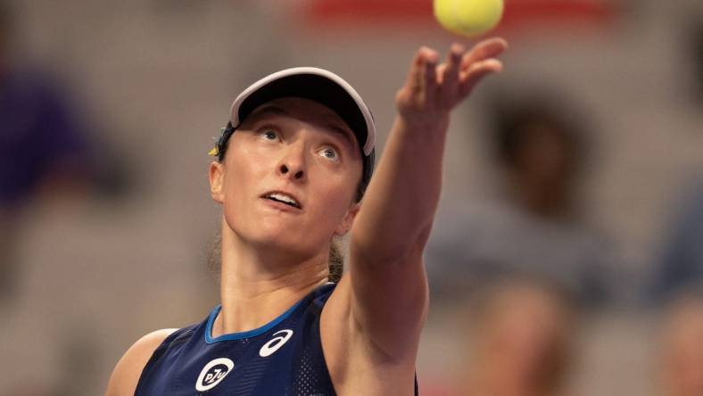 Nov 1, 2022; Forth Worth, TX, USA; Iga Swiatek (POL) tosses the ball to serve during her match against Daria Kasatkina on day two of the WTA Finals at Dickies Arena. Mandatory Credit: Susan Mullane-USA TODAY Sports