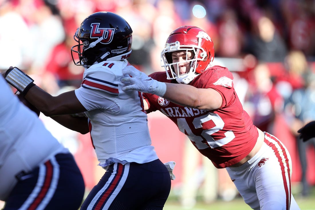 rkansas Razorbacks linebacker Drew Sanders (42) tackles Liberty Flames quarterback Johnathan Bennett (11) in the second quarter at Donald W. Reynolds Razorback Stadium. Mandatory Credit: Nelson Chenault-USA TODAY Sports