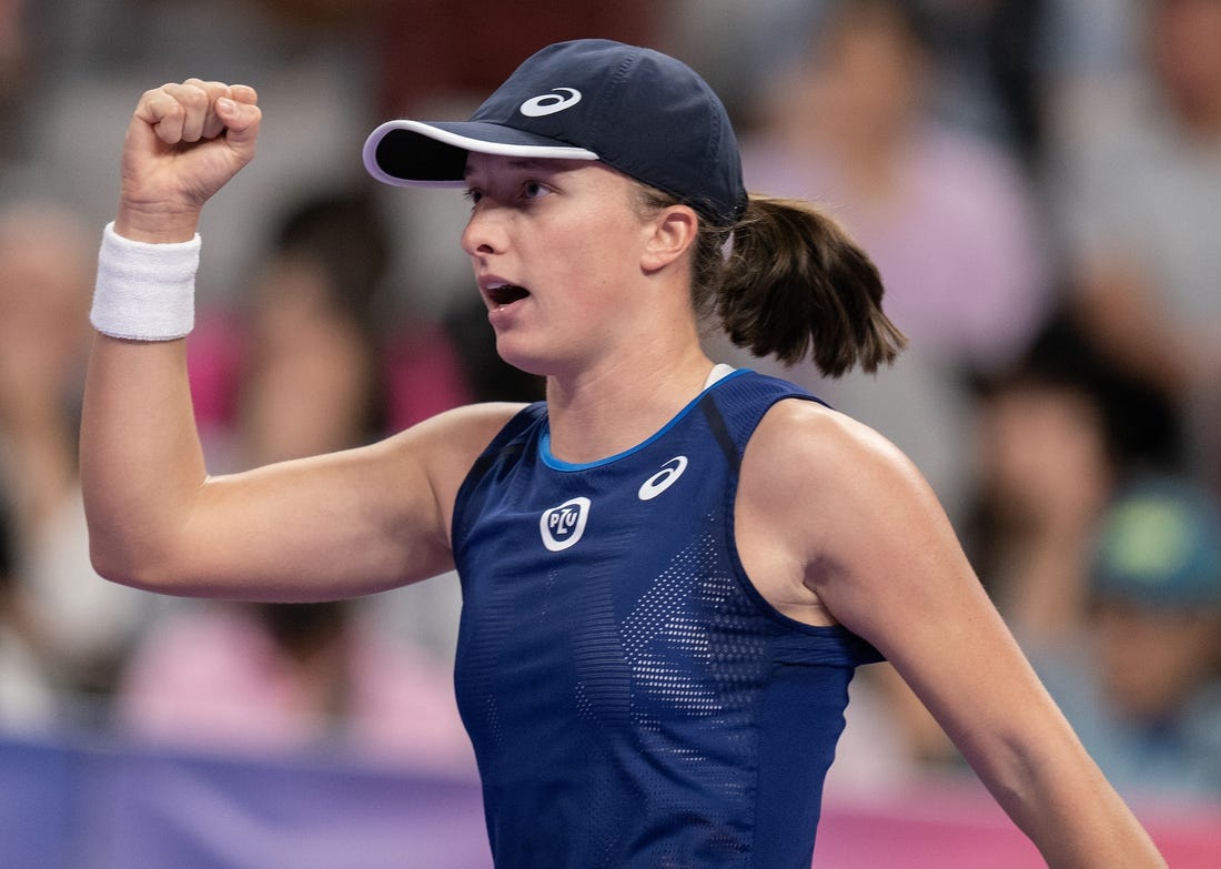 Nov 6, 2022; Forth Worth, TX, USA; Iga Swiatek (POL) reacts to a point during her semi final match against Aryna Sabalenka on day seven of the WTA Finals at Dickies Arena. Mandatory Credit: Susan Mullane-USA TODAY Sports