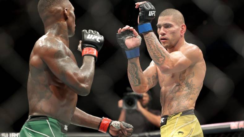 Nov 12, 2022; New York, NY, USA; Israel Adesanya (red gloves) and Alex Pereira (blue gloves) during UFC 281 at Madison Square Garden. Mandatory Credit: Jessica Alcheh-USA TODAY Sports