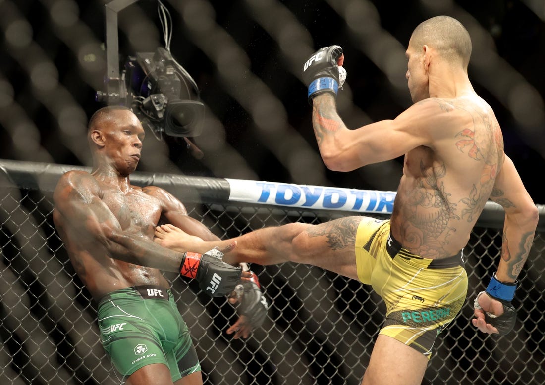 Nov 12, 2022; New York, NY, USA; Israel Adesanya (red gloves) and Alex Pereira (blue gloves) during UFC 281 at Madison Square Garden. Mandatory Credit: Jessica Alcheh-USA TODAY Sports