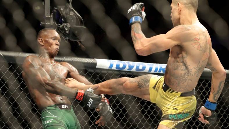 Nov 12, 2022; New York, NY, USA; Israel Adesanya (red gloves) and Alex Pereira (blue gloves) during UFC 281 at Madison Square Garden. Mandatory Credit: Jessica Alcheh-USA TODAY Sports