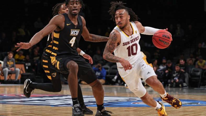 Nov 16, 2022; Brooklyn, New York, USA; Arizona State Sun Devils guard Frankie Collins (10) dribbles against Virginia Commonwealth Rams forward Jalen DeLoach (4) during the first half at Barclays Center. Mandatory Credit: Vincent Carchietta-USA TODAY Sports