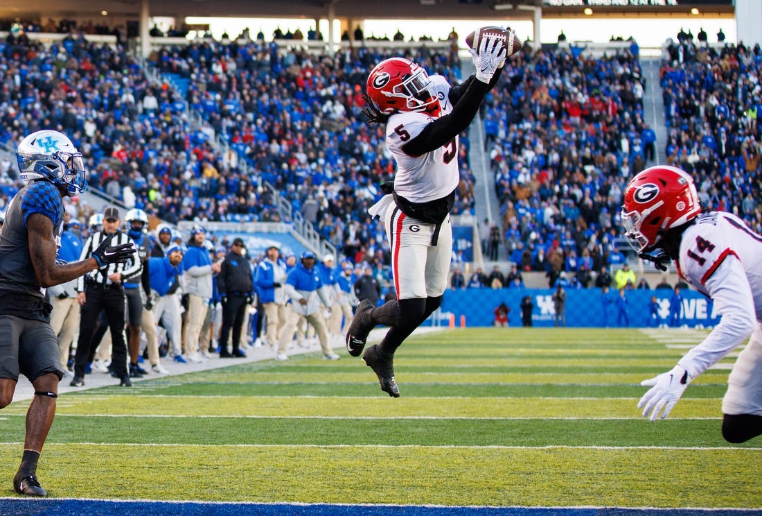 Nov 19, 2022; Lexington, Kentucky, USA; Georgia Bulldogs defensive back Kelee Ringo (5) intercepts a pass during the second quarter against the Kentucky Wildcats at Kroger Field. Mandatory Credit: Jordan Prather-USA TODAY Sports