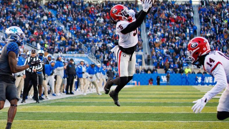 Nov 19, 2022; Lexington, Kentucky, USA; Georgia Bulldogs defensive back Kelee Ringo (5) intercepts a pass during the second quarter against the Kentucky Wildcats at Kroger Field. Mandatory Credit: Jordan Prather-USA TODAY Sports