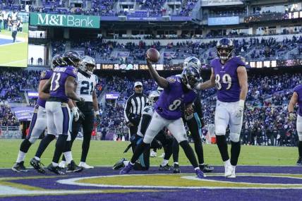 Nov 20, 2022; Baltimore, Maryland, USA;  Baltimore Ravens quarterback Lamar Jackson (8) spikes the ball after running for a touchdown against the Carolina Panthers during the second half at M&T Bank Stadium. Mandatory Credit: Jessica Rapfogel-USA TODAY Sports