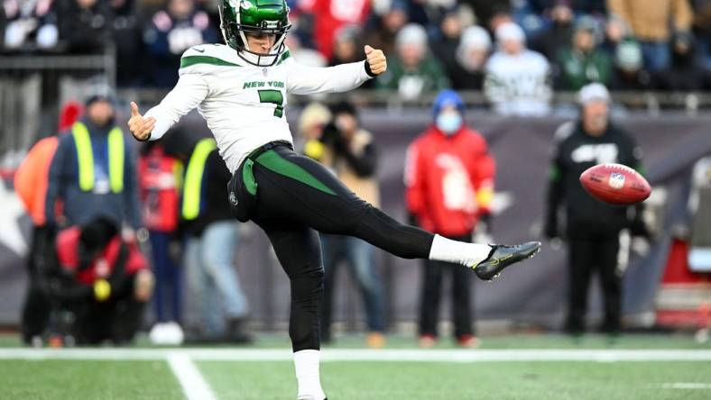 Nov 20, 2022; Foxborough, Massachusetts, USA; New York Jets punter Braden Mann (7) kicks the ball against the New England Patriots during the second half at Gillette Stadium. Mandatory Credit: Brian Fluharty-USA TODAY Sports