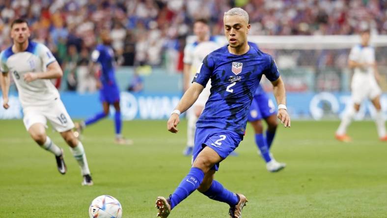 Nov 25, 2022; Al Khor, Qatar; United States of America defender Sergino Dest (2) kicks the ball against England during the second half of a group stage match during the 2022 World Cup at Al Bayt Stadium. Mandatory Credit: Yukihito Taguchi-USA TODAY Sports