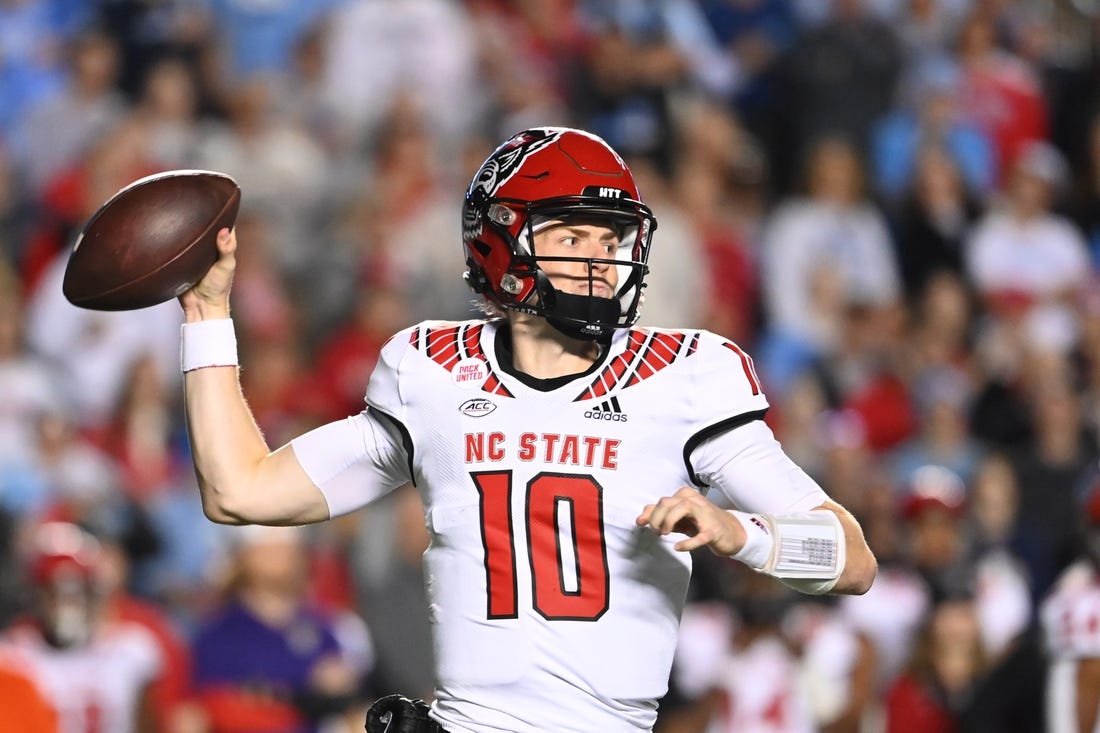 Nov 25, 2022; Chapel Hill, North Carolina, USA; North Carolina State Wolfpack quarterback Ben Finley (10) looks to pass in the fourth quarter at Kenan Memorial Stadium. Mandatory Credit: Bob Donnan-USA TODAY Sports