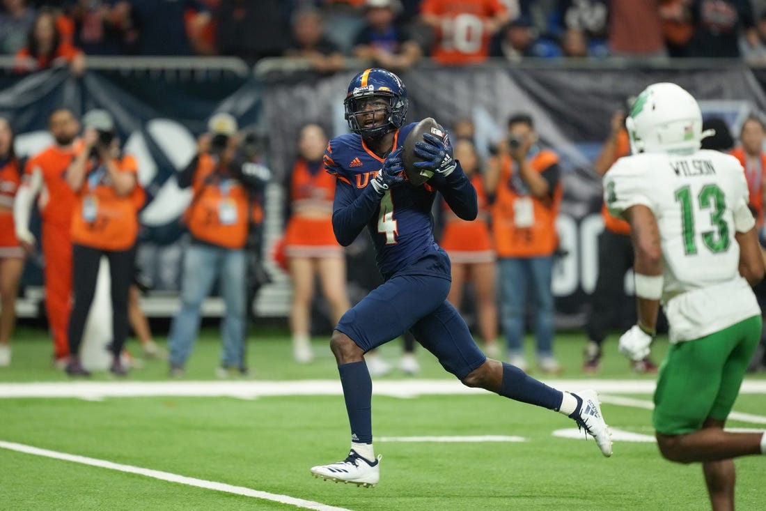 Dec 2, 2022; San Antonio, Texas, USA;  UTSA Roadrunners wide receiver Zakhari Franklin (4) catches a touchdown in the second half against the North Texas Mean Green at the Alamodome. Mandatory Credit: Daniel Dunn-USA TODAY Sports