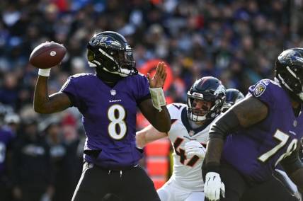 Dec 4, 2022; Baltimore, Maryland, USA;  Baltimore Ravens quarterback Lamar Jackson (8) drops back to pass during the first quarter against the Denver Broncos at M&T Bank Stadium. Mandatory Credit: Tommy Gilligan-USA TODAY Sports