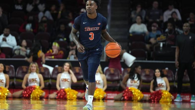 Dec 7, 2022; Los Angeles, California, USA; Cal State Fullerton Titans guard Latrell Wrightsell Jr. (3) dribbles the ball against the Southern California Trojans in the first half at Galen Center. Mandatory Credit: Kirby Lee-USA TODAY Sports