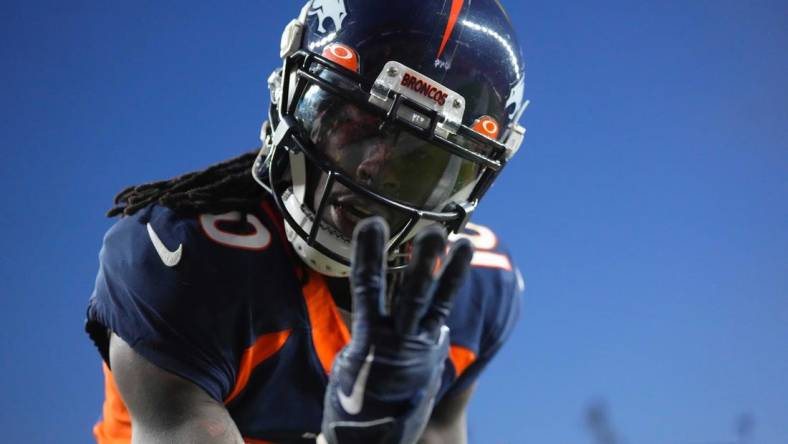 Dec 11, 2022; Denver, Colorado, USA; Denver Broncos wide receiver Jerry Jeudy (10) reacts to his third touchdown reception of the game in the fourth quarter against the Kansas City Chiefs at Empower Field at Mile High. Mandatory Credit: Ron Chenoy-USA TODAY Sports