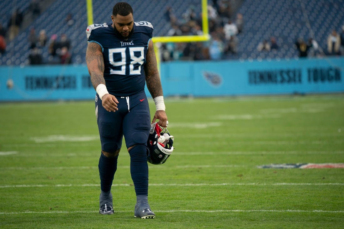 Tennessee Titans defensive tackle Jeffery Simmons (98) walks across the field after their 36 to 22 loss against the Jacksonville Jaguars at Nissan Stadium Sunday, Dec. 11, 2022, in Nashville, Tenn.

Nfl Jacksonville Jaguars At Tennessee Titans