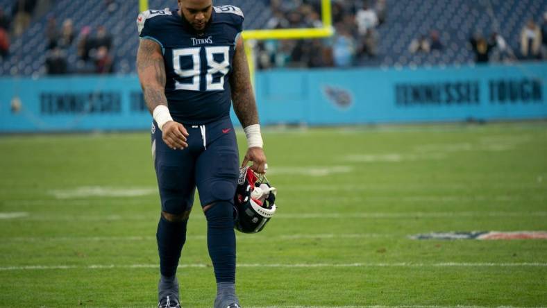 Tennessee Titans defensive tackle Jeffery Simmons (98) walks across the field after their 36 to 22 loss against the Jacksonville Jaguars at Nissan Stadium Sunday, Dec. 11, 2022, in Nashville, Tenn.

Nfl Jacksonville Jaguars At Tennessee Titans