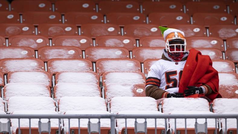 Dec 24, 2022; Cleveland, Ohio, USA; A Cleveland Browns sits in a snow covered seat during the first quarter against the New Orleans Saints at FirstEnergy Stadium. Mandatory Credit: Scott Galvin-USA TODAY Sports