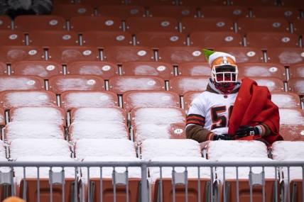 Dec 24, 2022; Cleveland, Ohio, USA; A Cleveland Browns sits in a snow covered seat during the first quarter against the New Orleans Saints at FirstEnergy Stadium. Mandatory Credit: Scott Galvin-USA TODAY Sports