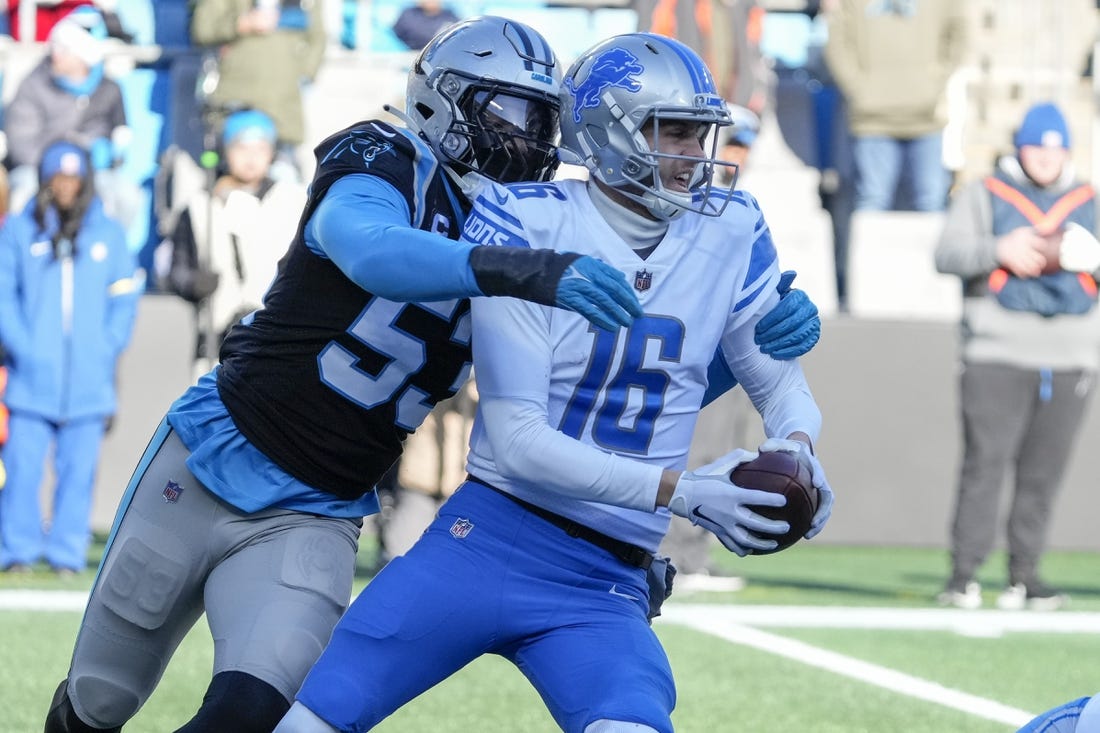 Dec 24, 2022; Charlotte, North Carolina, USA; Carolina Panthers defensive end Brian Burns (53) sacks Detroit Lions quarterback Jared Goff (16) during the second half at Bank of America Stadium. Mandatory Credit: Jim Dedmon-USA TODAY Sports