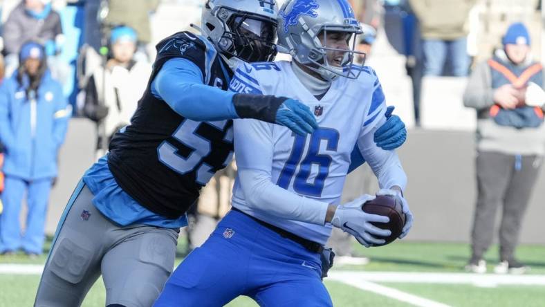 Dec 24, 2022; Charlotte, North Carolina, USA; Carolina Panthers defensive end Brian Burns (53) sacks Detroit Lions quarterback Jared Goff (16) during the second half at Bank of America Stadium. Mandatory Credit: Jim Dedmon-USA TODAY Sports