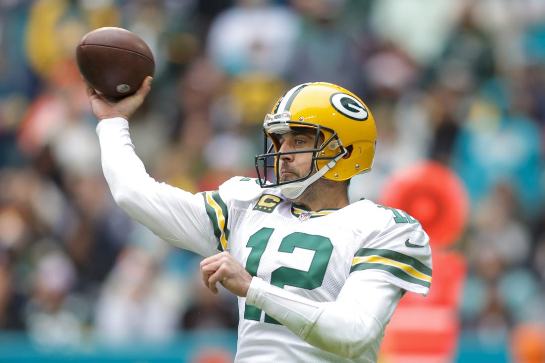 Dec 25, 2022; Miami Gardens, Florida, USA; Green Bay Packers quarterback Aaron Rodgers (12) throws the football during the second quarter against the Miami Dolphins at Hard Rock Stadium. Mandatory Credit: Sam Navarro-USA TODAY Sports