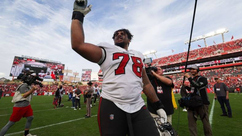 Jan 1, 2023; Tampa, Florida, USA;  Tampa Bay Buccaneers offensive tackle Tristan Wirfs (78) celebrates after beating the Carolina Panthers at Raymond James Stadium. Mandatory Credit: Nathan Ray Seebeck-USA TODAY Sports