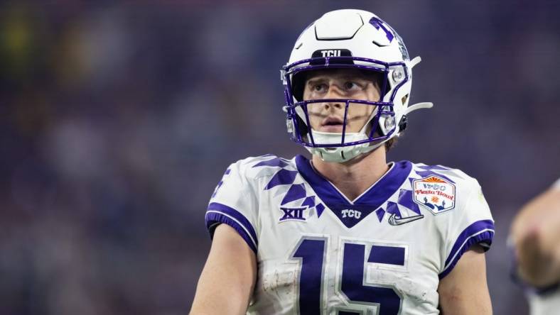 Dec 31, 2022; Glendale, Arizona, USA; TCU Horned Frogs quarterback Max Duggan (15) against the Michigan Wolverines during the 2022 Fiesta Bowl at State Farm Stadium. Mandatory Credit: Mark J. Rebilas-USA TODAY Sports