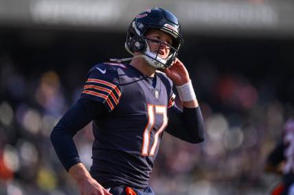 Jan 8, 2023; Chicago, Illinois, USA; Chicago Bears quarterback Tim Boyle (17) runs off the field during the second quarter against the Minnesota Vikings at Soldier Field. Mandatory Credit: Daniel Bartel-USA TODAY Sports