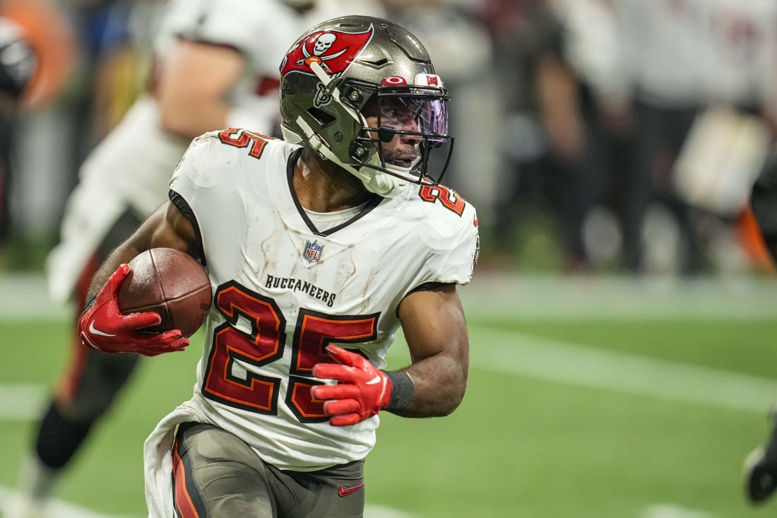 Jan 8, 2023; Atlanta, Georgia, USA; Tampa Bay Buccaneers running back Giovani Bernard (25) runs against the Atlanta Falcons during the second half at Mercedes-Benz Stadium. Mandatory Credit: Dale Zanine-USA TODAY Sports