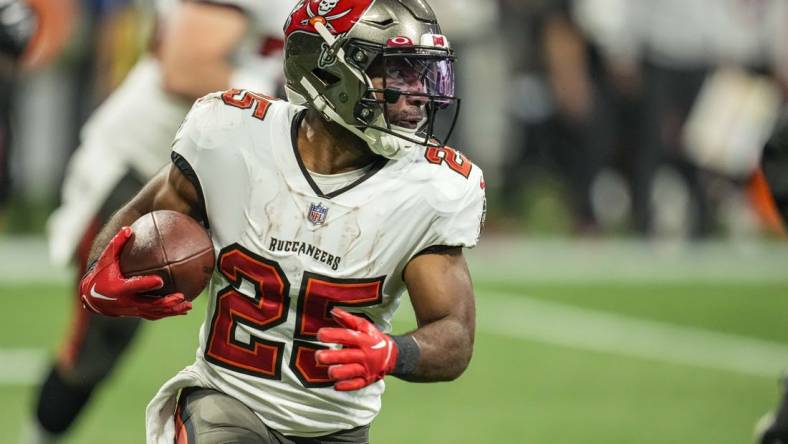 Jan 8, 2023; Atlanta, Georgia, USA; Tampa Bay Buccaneers running back Giovani Bernard (25) runs against the Atlanta Falcons during the second half at Mercedes-Benz Stadium. Mandatory Credit: Dale Zanine-USA TODAY Sports