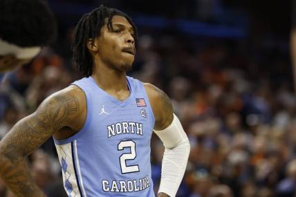 Jan 10, 2023; Charlottesville, Virginia, USA; North Carolina Tar Heels guard Caleb Love (2) reacts against the Virginia Cavaliers during a stoppage in play in the closing seconds in the second half at John Paul Jones Arena. Mandatory Credit: Geoff Burke-USA TODAY Sports
