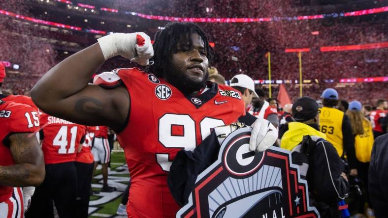 Jan 9, 2023; Inglewood, CA, USA; Georgia Bulldogs defensive lineman Bear Alexander (99) celebrates after defeating the TCU Horned Frogs during the CFP national championship game at SoFi Stadium. Mandatory Credit: Mark J. Rebilas-USA TODAY Sports